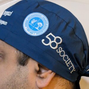 Custom embroidered scrub cap with medical association logo branding
